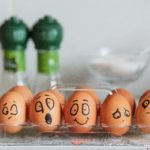 Eggs in a tray with painted faces