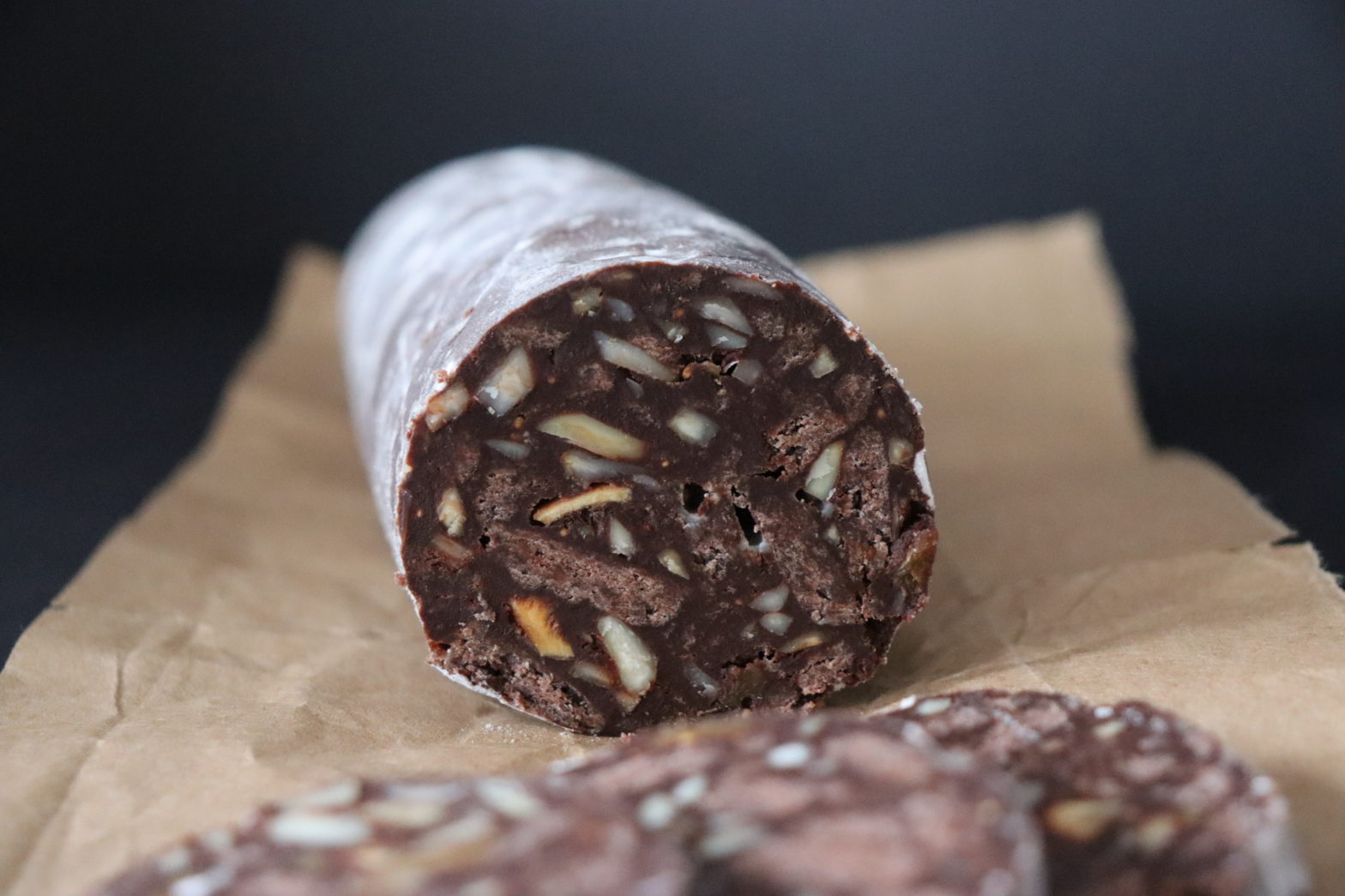 chocolade salami cuted in slices served on a wrapping paper