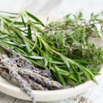 A bowl with rosemary, lavandel, Thyme