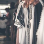 An open wardrobe with some clothing